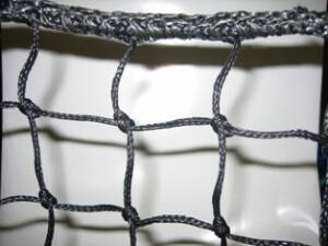Weighted edge to be sewn to netting